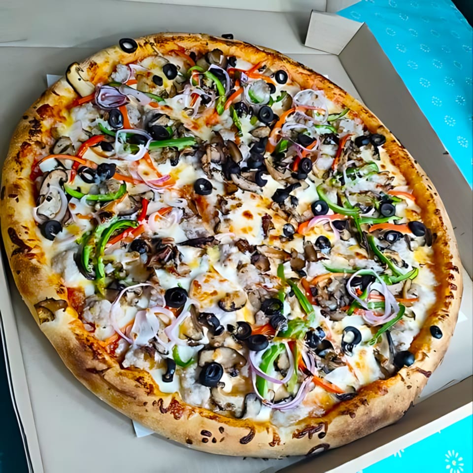 Gezziny's Homemade Pizza with mushrooms, olives, onions, and peppers in a box.
