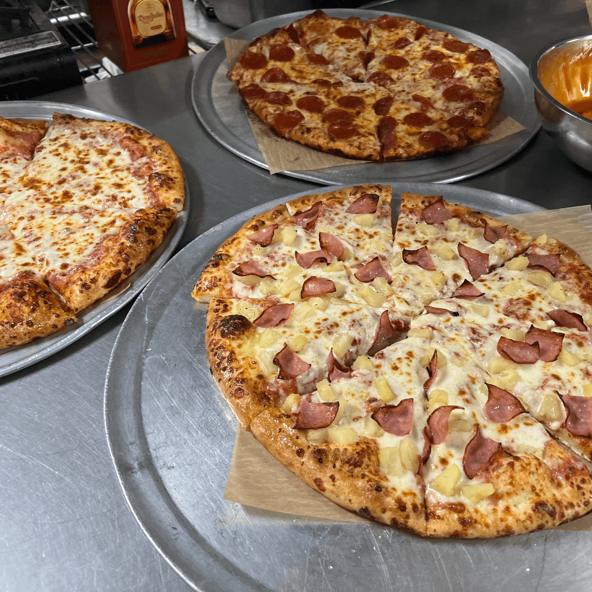 3 Medium 3 Topping Pizzas.